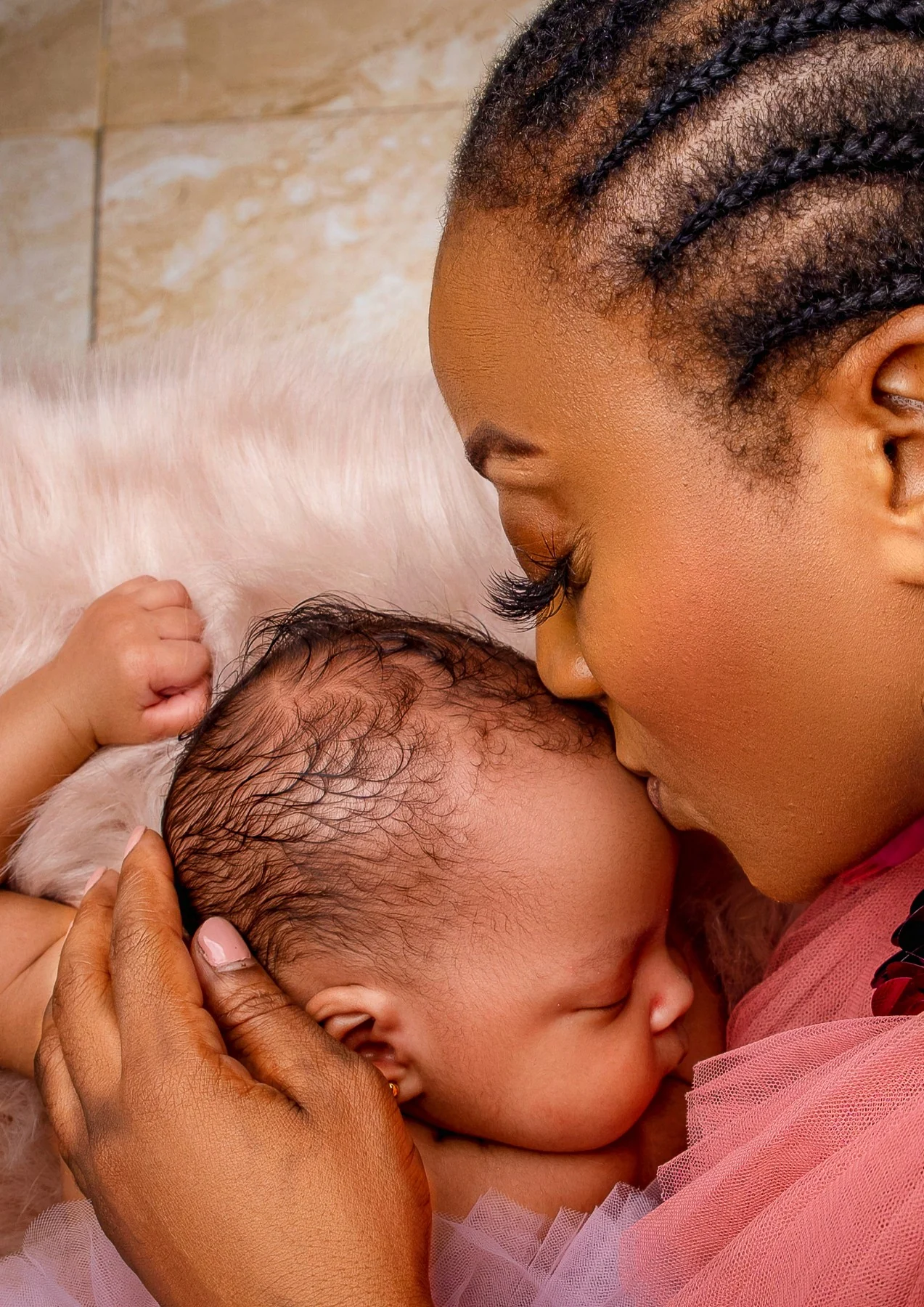Mother embracing her newborn