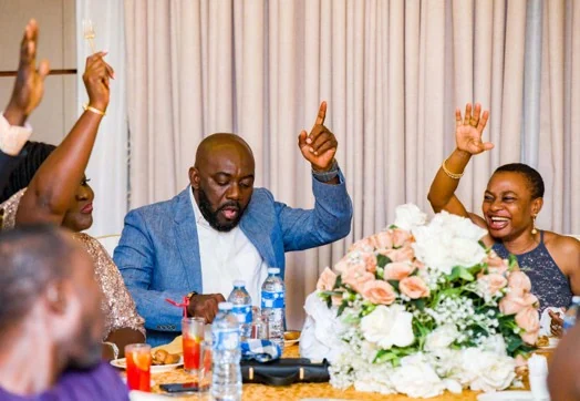 Guests celebrating around a table